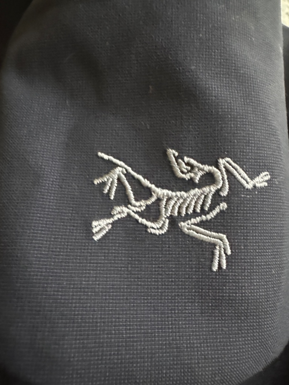 Arcteryx Patera long coat in navy blue.